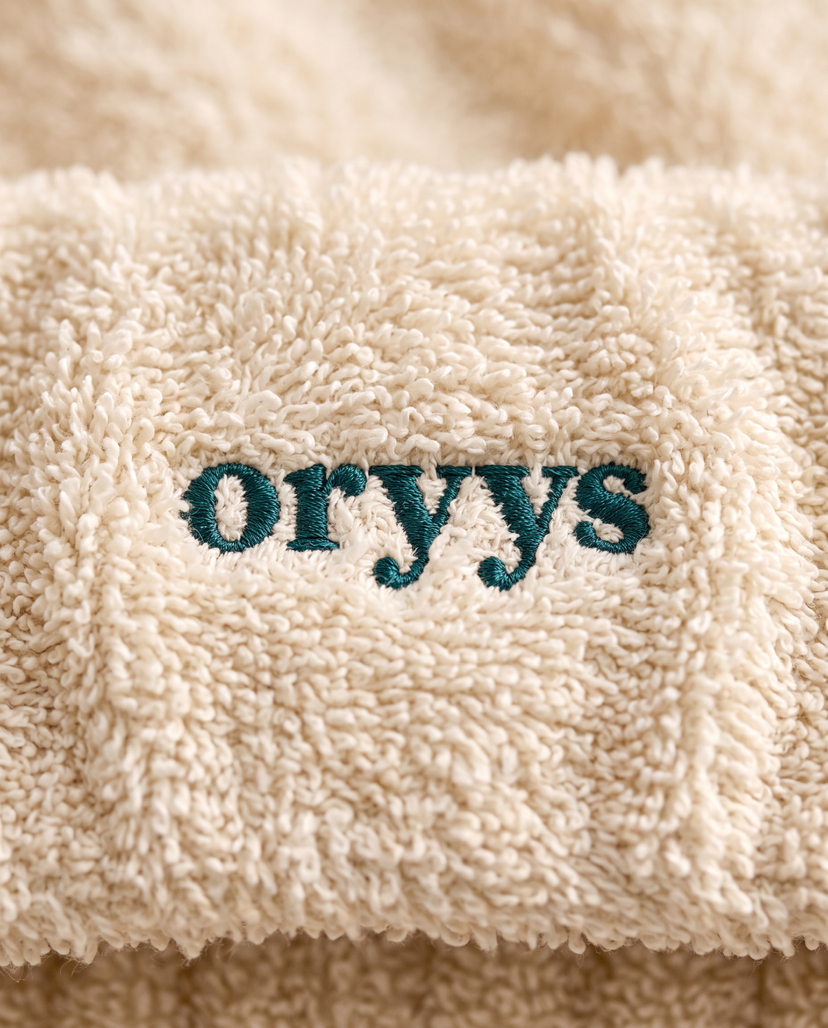 Embroidered ORYYS wordmark on terry